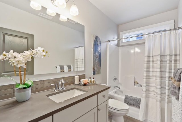 full bathroom featuring toilet, visible vents, vanity, backsplash, and shower / bathtub combination with curtain