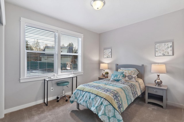 bedroom featuring carpet floors and baseboards