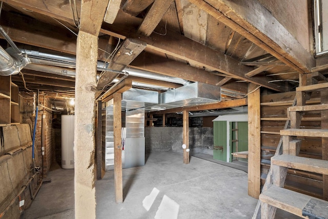 unfinished basement with heating unit and gas water heater