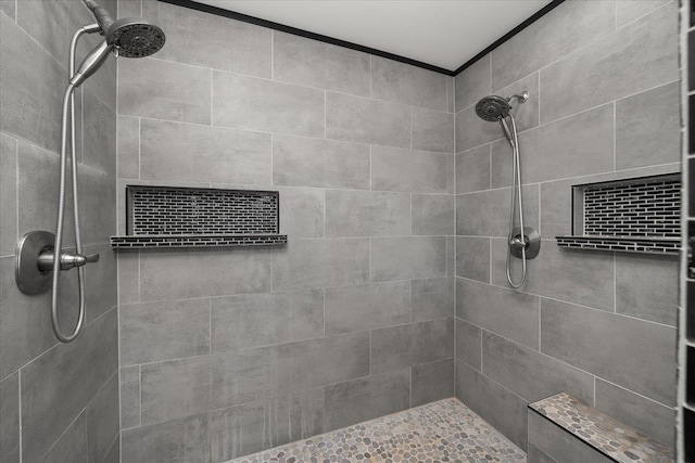 bathroom with a tile shower