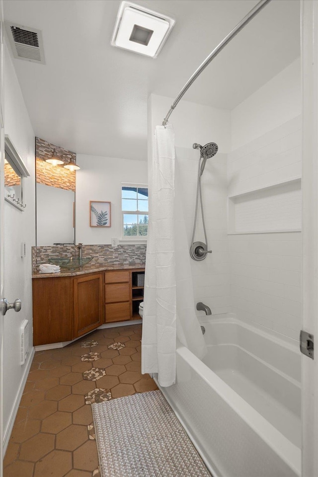 full bath with shower / bath combo with shower curtain, tile patterned flooring, vanity, and visible vents