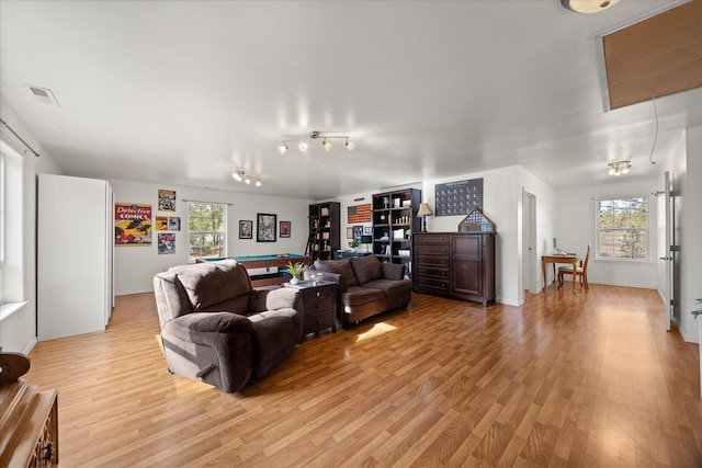 living room with attic access, pool table, visible vents, and light wood finished floors