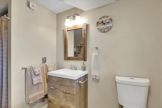 full bathroom featuring vanity and toilet