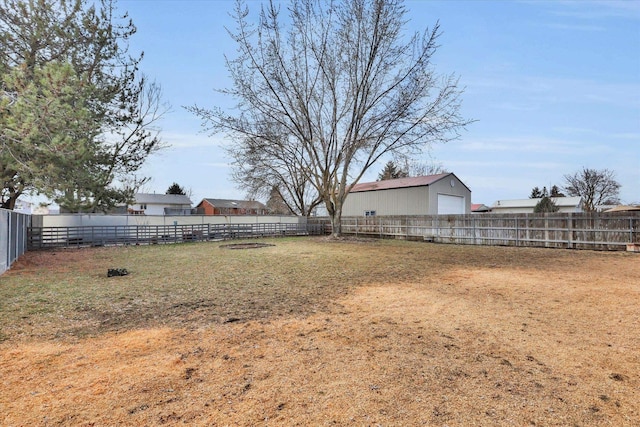 view of yard featuring an outbuilding and fence private yard