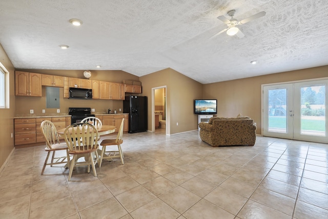 dining area with lofted ceiling, french doors, a textured ceiling, and light tile patterned floors