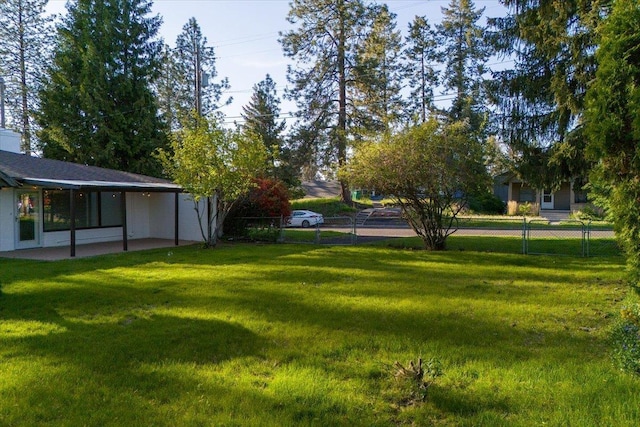 view of yard featuring fence private yard and a patio area