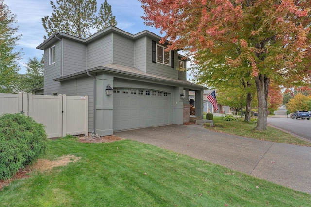 view of front of property with a garage, a front lawn, fence, and aphalt driveway