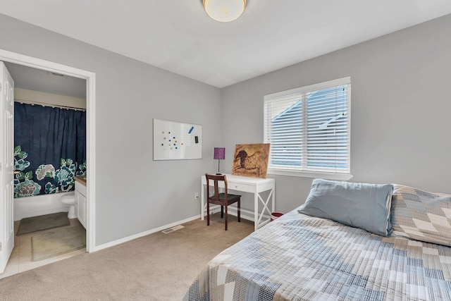 bedroom featuring carpet floors, visible vents, and baseboards