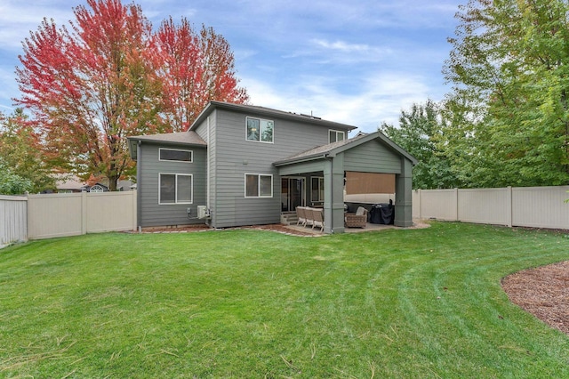 back of property featuring a patio area, a lawn, and a fenced backyard