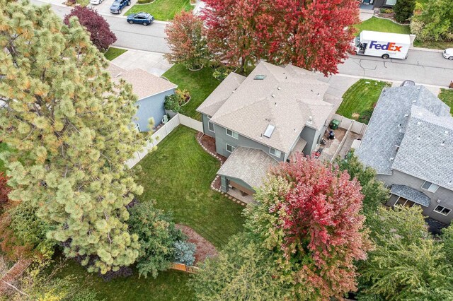 birds eye view of property with a residential view