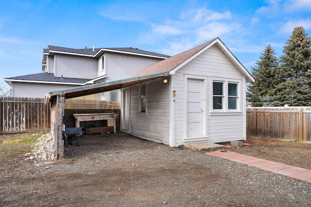 view of home's exterior with fence