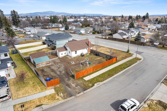 drone / aerial view featuring a residential view and a mountain view