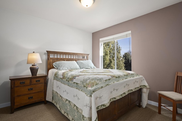 carpeted bedroom with baseboards