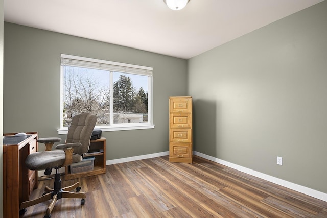 office featuring baseboards and wood finished floors