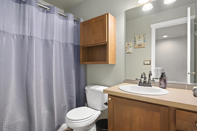 full bathroom with toilet, a shower with curtain, and vanity