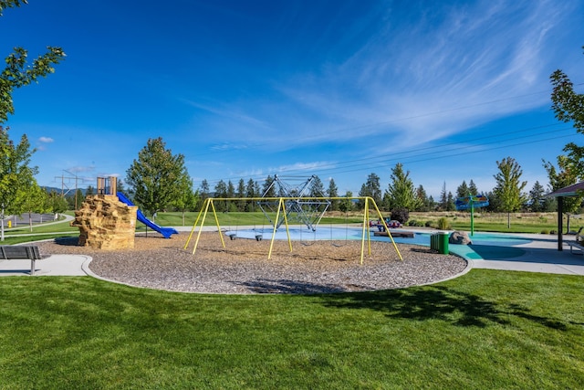 community play area with a yard