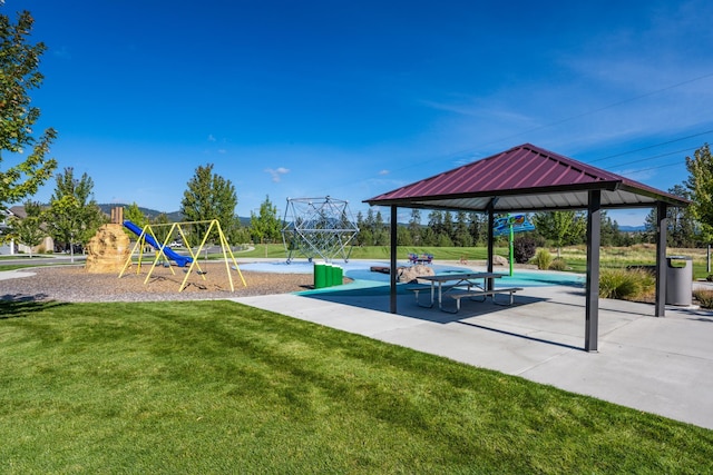 communal playground with a lawn and a gazebo