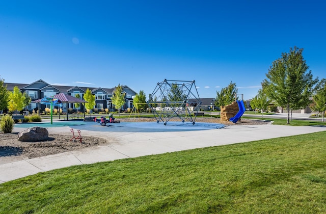 view of playground featuring a residential view, a lawn, and a gazebo