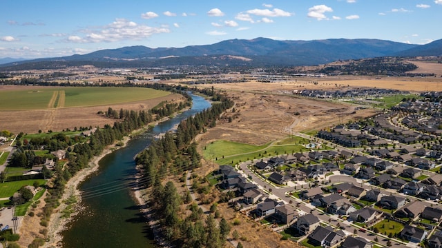 bird's eye view featuring a water and mountain view