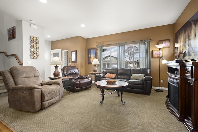 living area featuring light carpet, stairs, baseboards, and recessed lighting