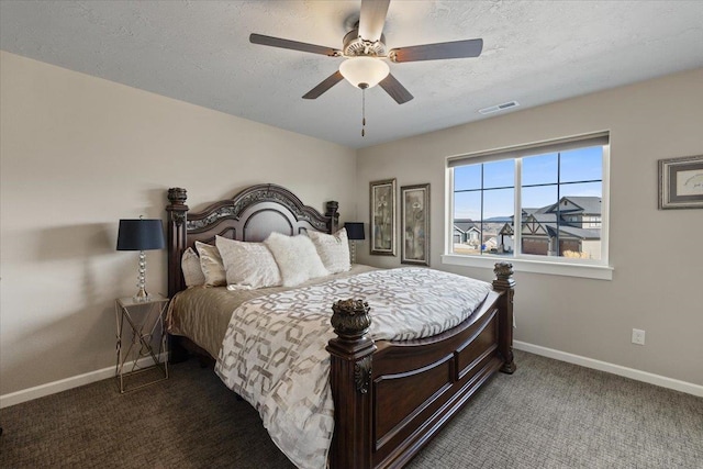 bedroom with a textured ceiling, carpet flooring, a ceiling fan, visible vents, and baseboards