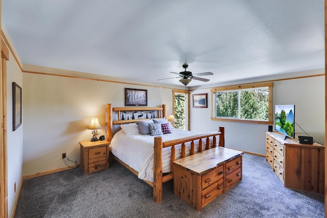 carpeted bedroom featuring a ceiling fan and baseboards