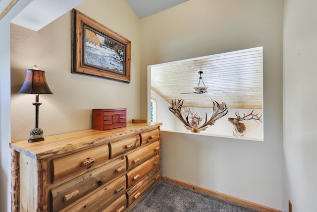 details featuring a ceiling fan, carpet, and baseboards