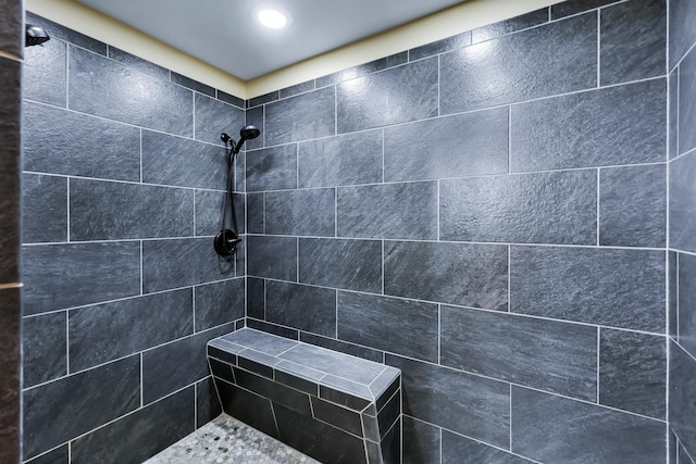 bathroom with tiled shower