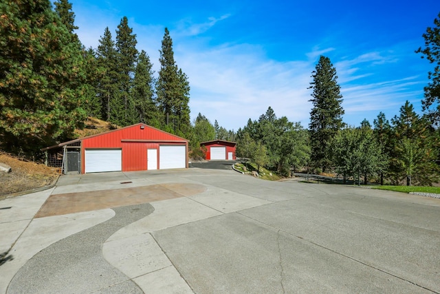 detached garage with concrete driveway