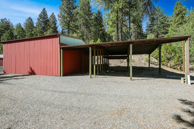 exterior space with driveway and a carport