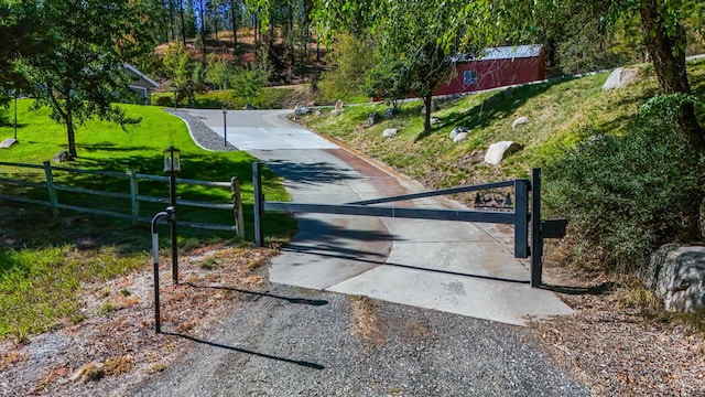 view of gate featuring fence