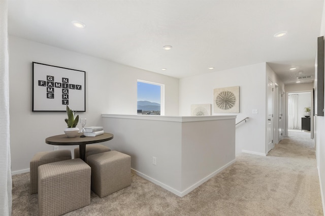 corridor featuring carpet, baseboards, and recessed lighting