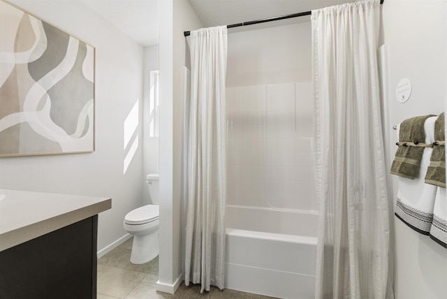 full bath featuring toilet, shower / bath combo, vanity, baseboards, and tile patterned floors