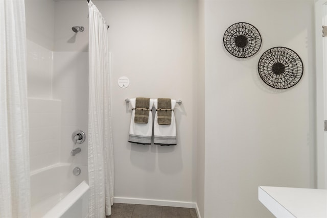 full bathroom with shower / bathtub combination with curtain, baseboards, and tile patterned floors