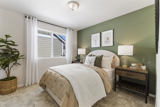 bedroom featuring carpet flooring and baseboards