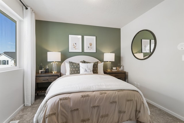 bedroom with carpet and baseboards