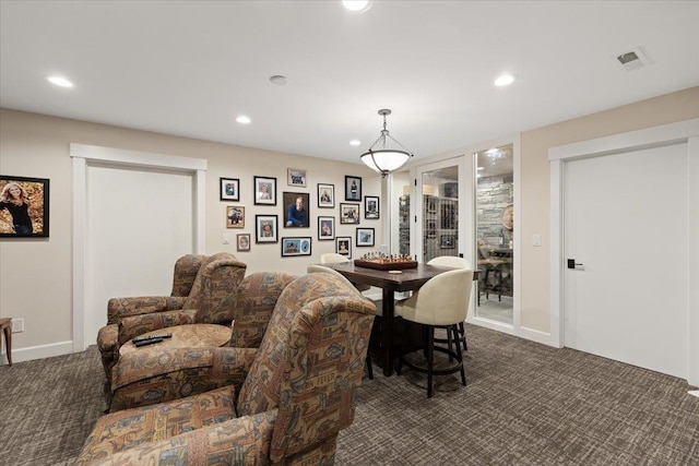 dining room featuring dark colored carpet, visible vents, and recessed lighting