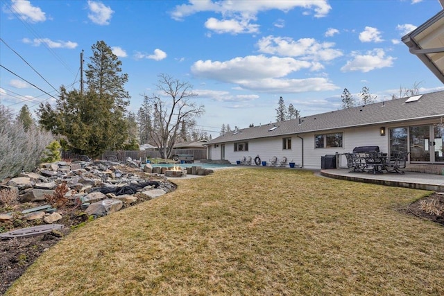 view of yard featuring a fenced backyard, a pool, and a patio