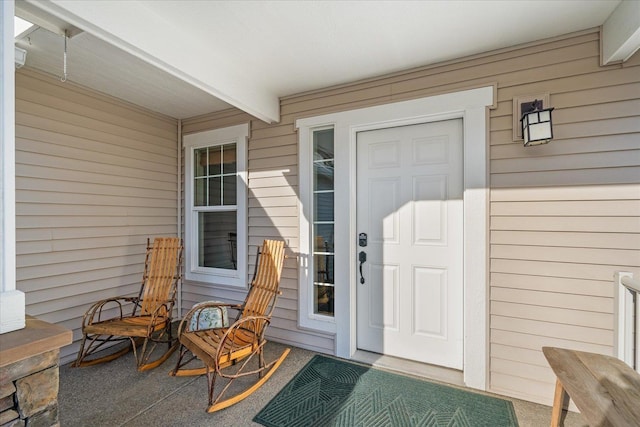 entrance to property featuring a porch