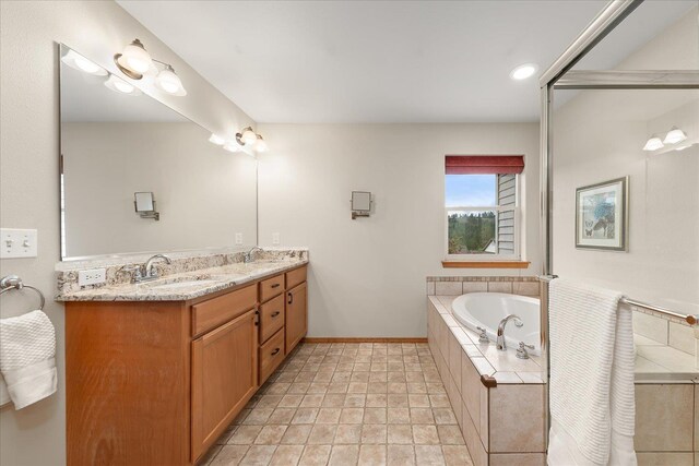 711 W Bolan Ave, Spokane, WA 99224 - full bath featuring double vanity, a bath, and baseboards