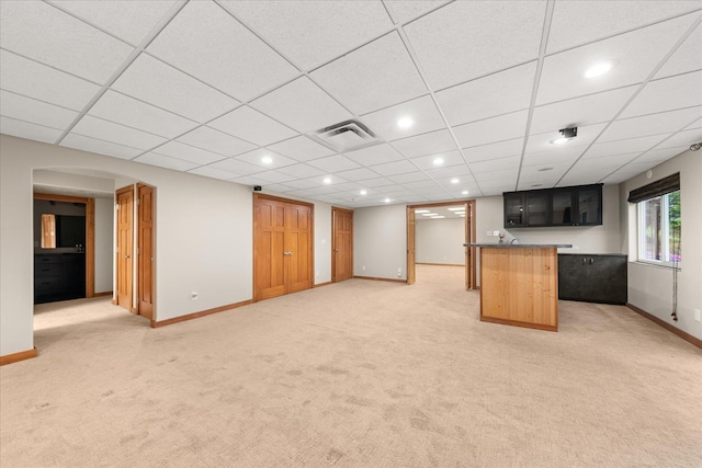 711 W Bolan Ave, Spokane, WA 99224 - below grade area with light colored carpet, baseboards, recessed lighting, bar, and a drop ceiling