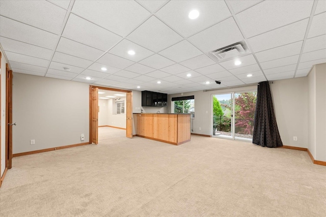 711 W Bolan Ave, Spokane, WA 99224 - unfurnished living room with light carpet, baseboards, recessed lighting, and a paneled ceiling