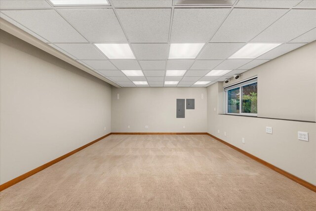 711 W Bolan Ave, Spokane, WA 99224 - empty room featuring light colored carpet, baseboards, a drop ceiling, and electric panel