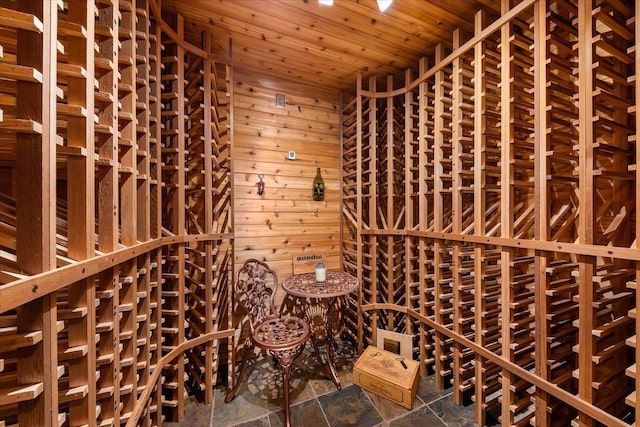 711 W Bolan Ave, Spokane, WA 99224 - wine cellar with wooden ceiling, wooden walls, and dark stone finish floors