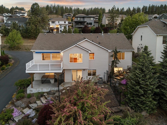 711 W Bolan Ave, Spokane, WA 99224 - rear view of property with a residential view, a patio area, fence, and roof with shingles