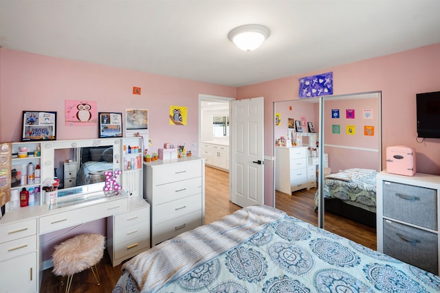 bedroom with wood finished floors