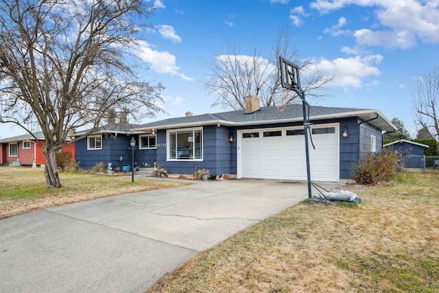 ranch-style house featuring a front yard, driveway, a chimney, and an attached garage