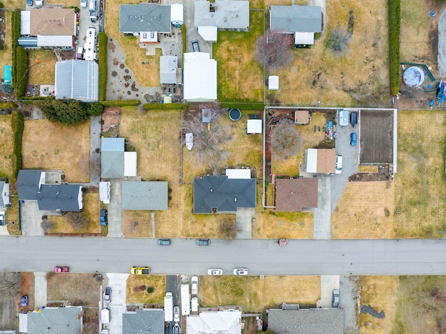 birds eye view of property with a residential view