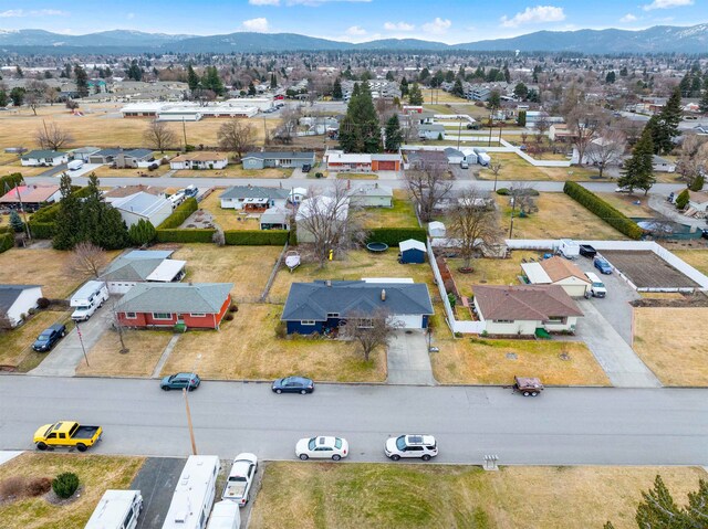 birds eye view of property with a residential view and a mountain view