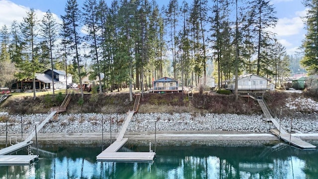 view of dock with stairs and a water view